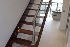 CONTEMPORARY STAIR WITH GLASS AND STAINLESS HANDRAIL